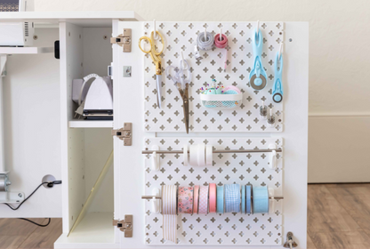 White pegboard with attachments and tools in a craft room setting [Deluxe]